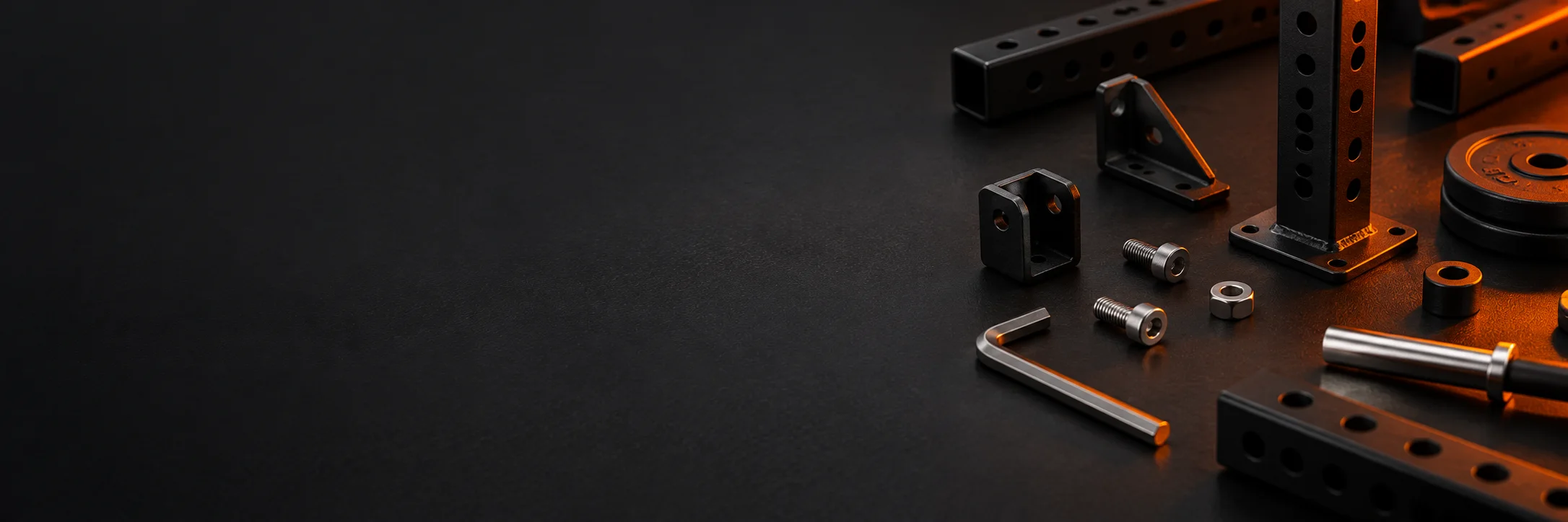 Miniature gym components and assembly tools on a workbench